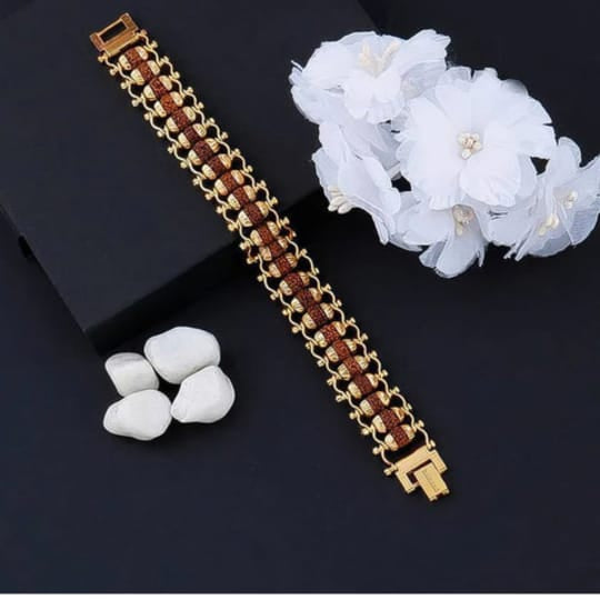 Gold bracelet with brown stones 